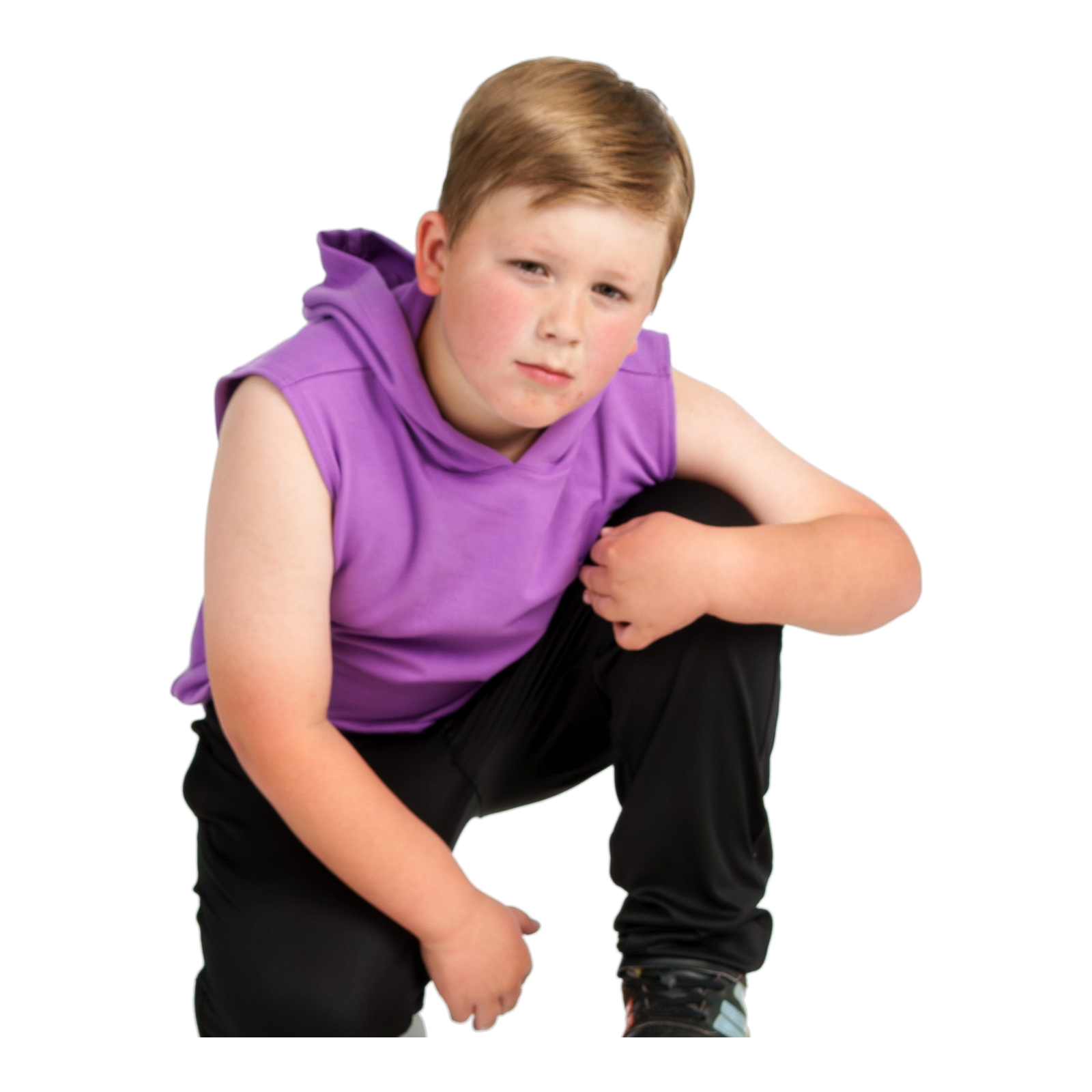 Young dancer in a purple top crouching playfully